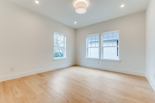 unfurnished room with light hardwood / wood-style floors