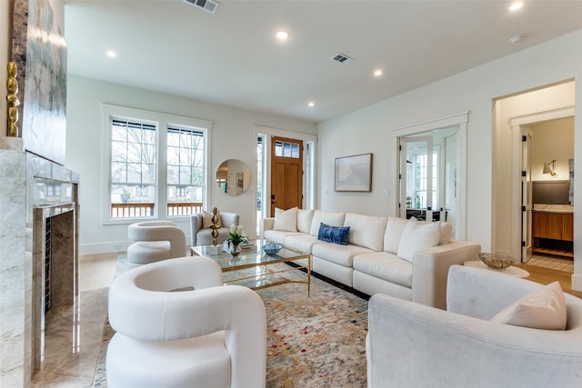 living room with plenty of natural light and a premium fireplace