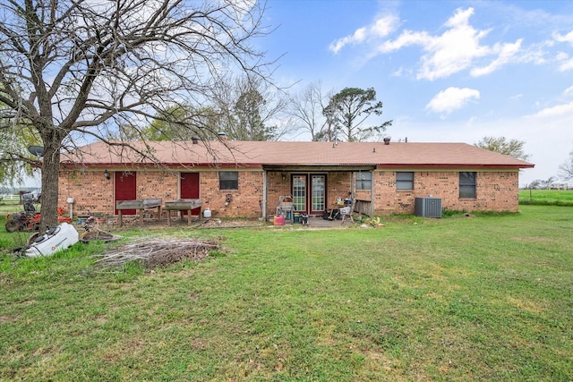 back of property featuring a patio area, central AC unit, and a lawn