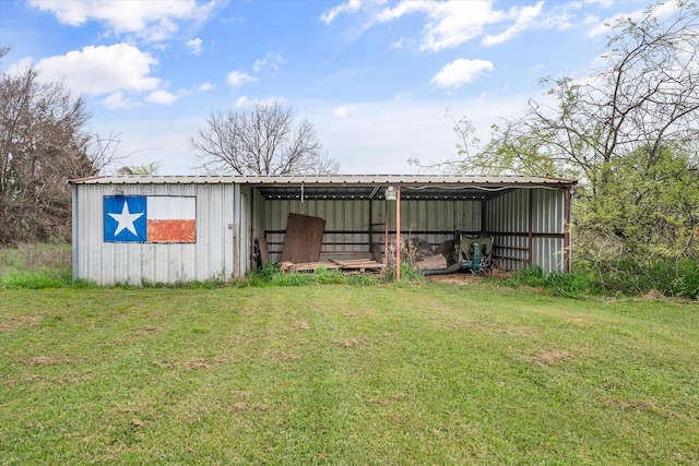 view of outdoor structure with a yard