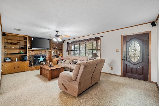 living room featuring a fireplace, ornamental molding, ceiling fan, light carpet, and a textured ceiling