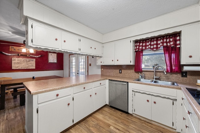 kitchen featuring white cabinetry, dishwasher, sink, kitchen peninsula, and light hardwood / wood-style flooring