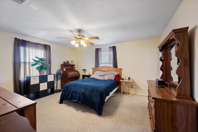 bedroom with multiple windows, carpet floors, and ceiling fan