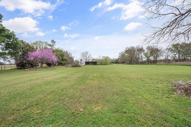 view of yard with a rural view