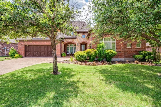 401 Devonshire Dr, Prosper, TX 75078 - view of front of house featuring concrete driveway, an attached garage, and brick siding