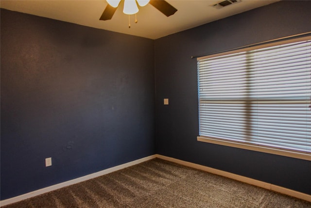 empty room with carpet floors and ceiling fan