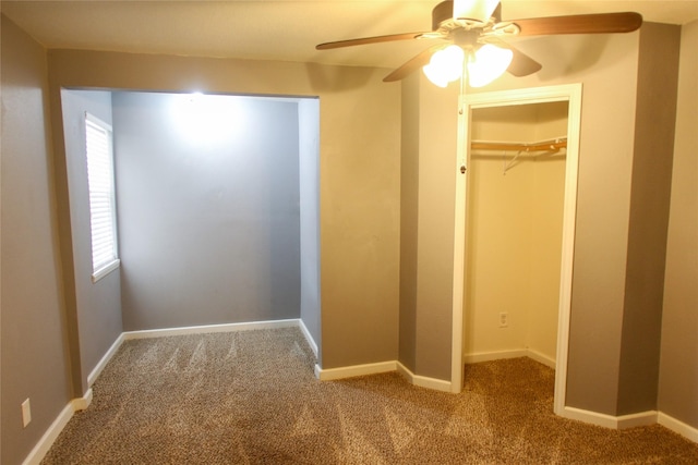 unfurnished bedroom with ceiling fan, a closet, and light carpet