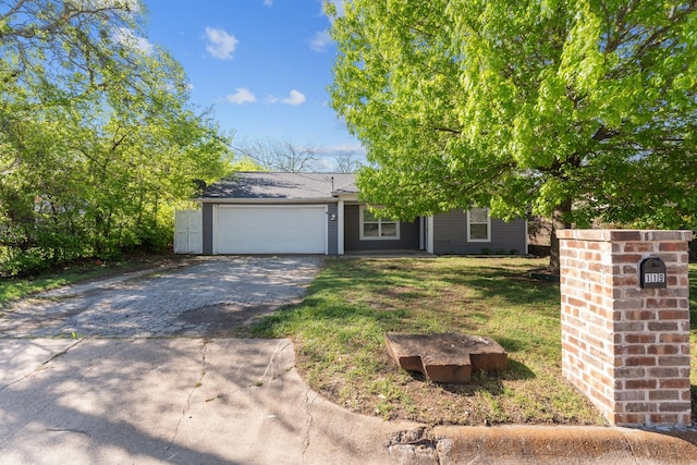 119 Wheeler St, Weatherford, TX 76086 - view of front of house featuring an attached garage, aphalt driveway, and a front yard