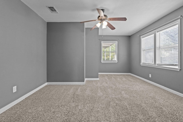 119 Wheeler St, Weatherford, TX 76086 - carpeted spare room with baseboards, a ceiling fan, and visible vents