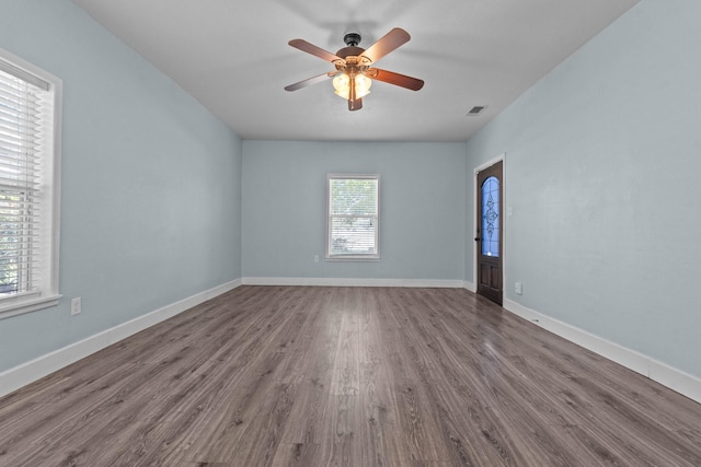 119 Wheeler St, Weatherford, TX 76086 - empty room featuring visible vents, baseboards, a ceiling fan, and wood finished floors