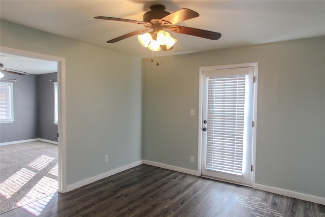 spare room featuring dark wood-type flooring