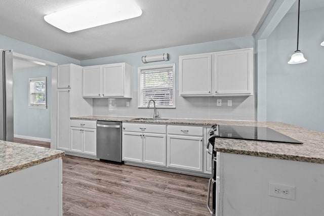 119 Wheeler St, Weatherford, TX 76086 - kitchen featuring a sink, white cabinetry, and stainless steel appliances