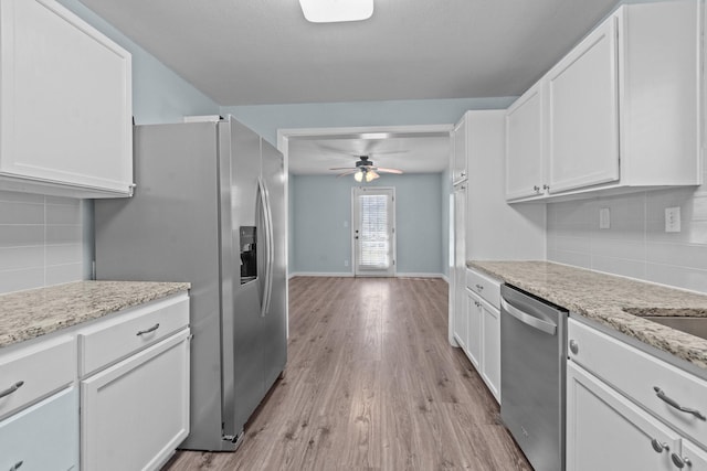 119 Wheeler St, Weatherford, TX 76086 - kitchen with tasteful backsplash, ceiling fan, white cabinetry, and stainless steel appliances