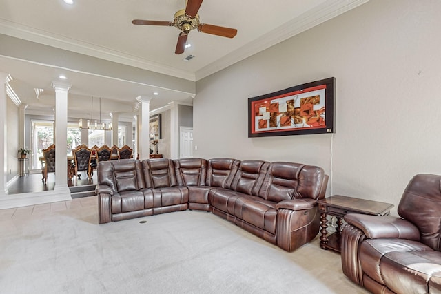 carpeted living room with crown molding, ceiling fan, and ornate columns