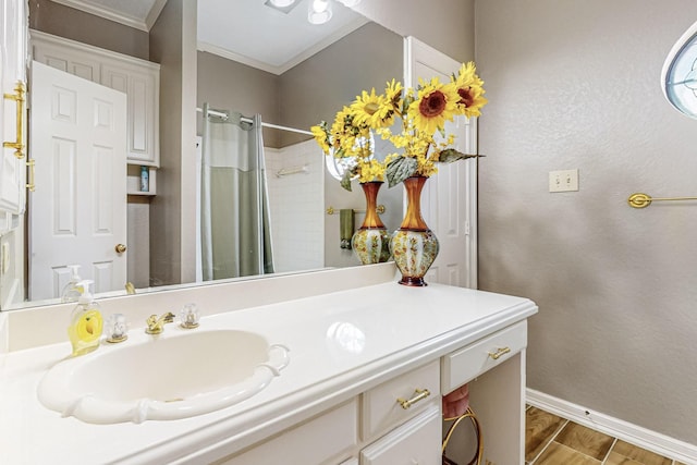 bathroom featuring vanity, hardwood / wood-style floors, ornamental molding, and a shower with shower curtain