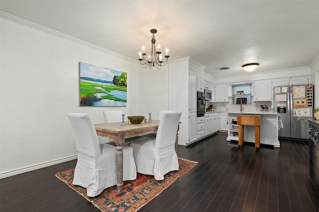 dining room featuring crown molding, dark hardwood / wood-style floors, and an inviting chandelier