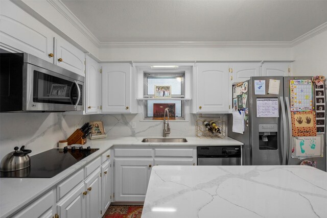 kitchen featuring white cabinetry, sink, crown molding, and appliances with stainless steel finishes