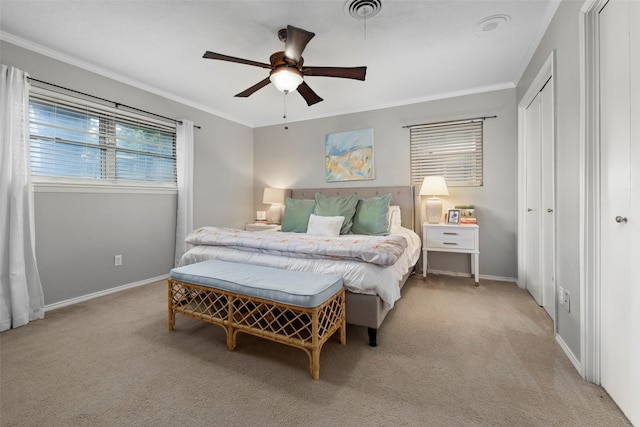 bedroom featuring crown molding, light colored carpet, and ceiling fan