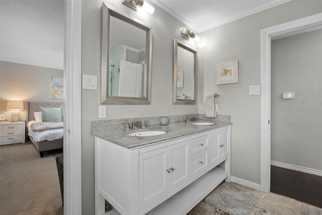 bathroom with crown molding and vanity