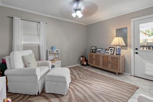 living area with ornamental molding, light tile patterned flooring, and ceiling fan