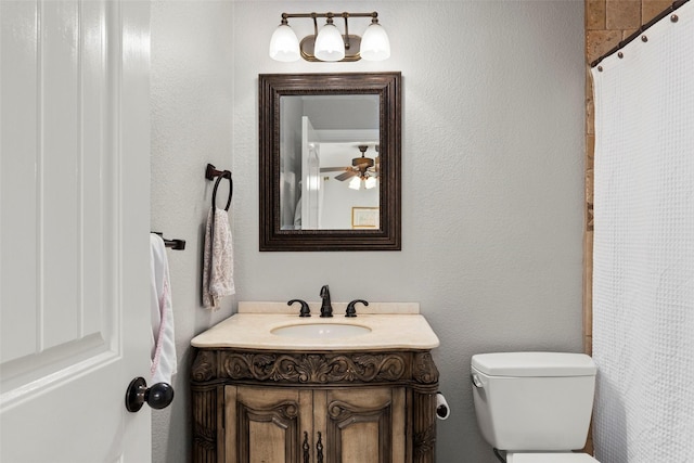 bathroom with ceiling fan, vanity, and toilet