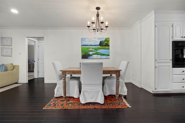 dining area with crown molding, dark hardwood / wood-style flooring, and an inviting chandelier