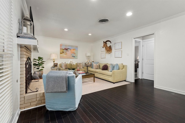 living room with ornamental molding and dark hardwood / wood-style floors