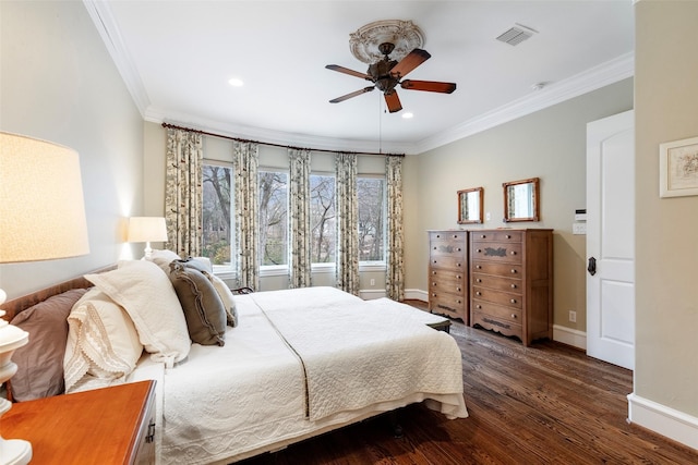 bedroom featuring dark hardwood / wood-style flooring, crown molding, and ceiling fan