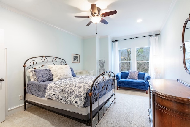 carpeted bedroom with crown molding and ceiling fan