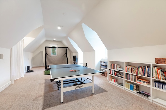 game room with vaulted ceiling and light colored carpet