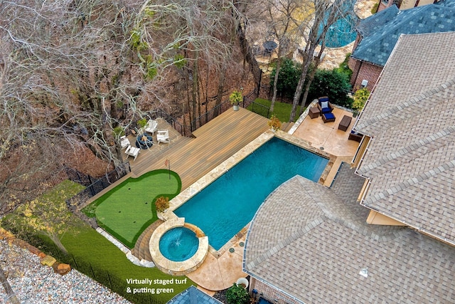 view of pool with a wooden deck