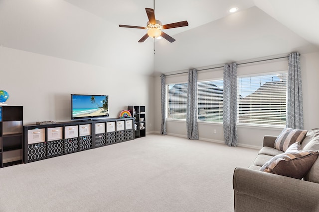 living room with ceiling fan, high vaulted ceiling, and light carpet