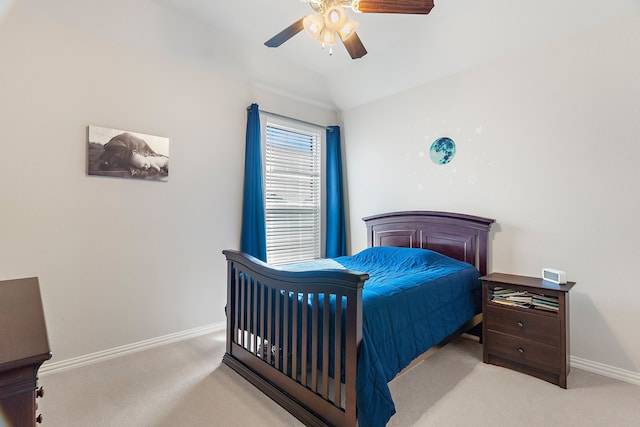 bedroom with lofted ceiling, light colored carpet, and ceiling fan