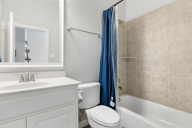 full bathroom featuring vanity, shower / bath combination with curtain, and toilet