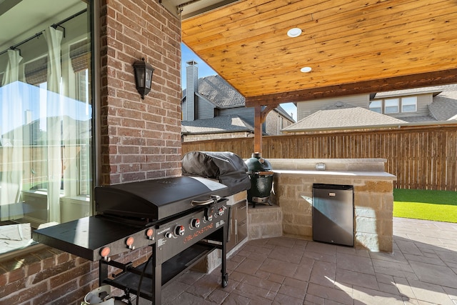 view of patio / terrace featuring an outdoor kitchen and area for grilling