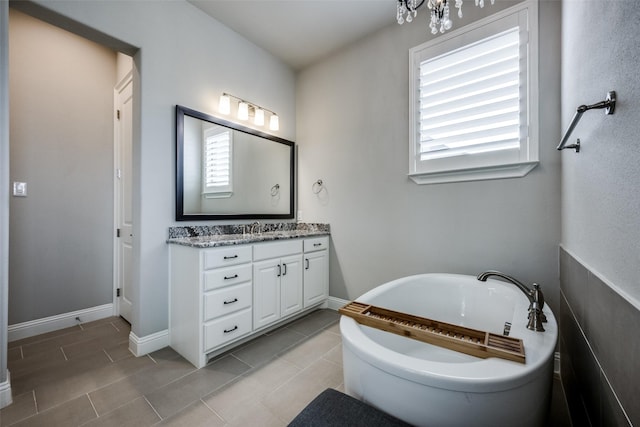 3316 Dovehill Dr, Northlake, TX 76247 - bathroom with vanity, a soaking tub, tile patterned floors, and baseboards