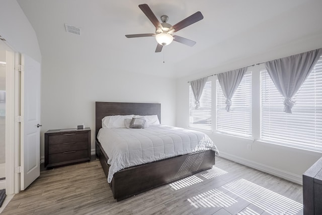 bedroom with ceiling fan and hardwood / wood-style floors