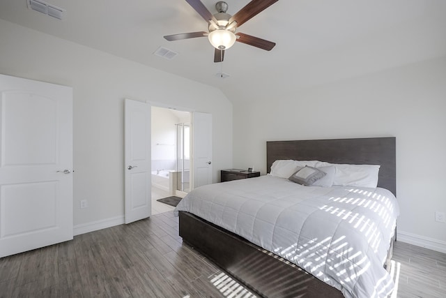 bedroom with lofted ceiling, hardwood / wood-style floors, connected bathroom, and ceiling fan