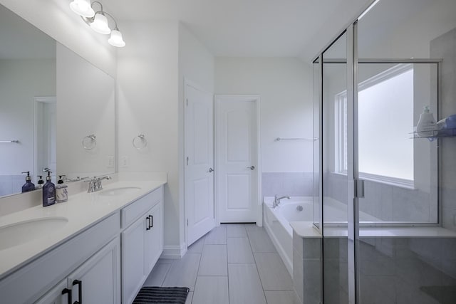 bathroom featuring vanity, separate shower and tub, and tile patterned floors