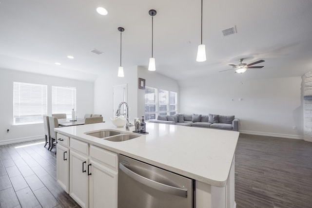 kitchen with sink, decorative light fixtures, dishwasher, a kitchen island with sink, and white cabinets