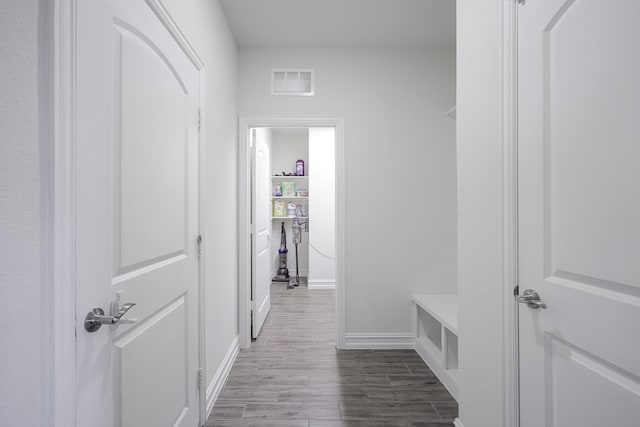 hall with wood-type flooring