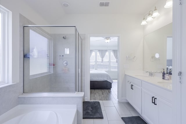 bathroom with vanity, tile patterned floors, ceiling fan, and a bathtub