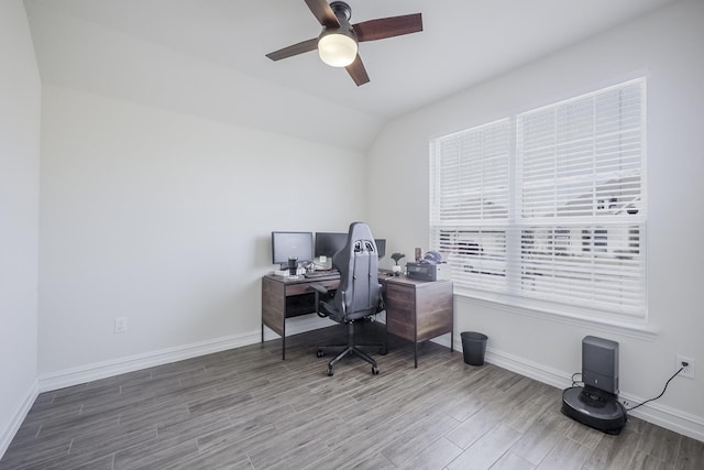 home office with hardwood / wood-style floors, vaulted ceiling, and ceiling fan