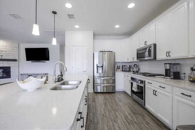 kitchen featuring sink, white cabinets, and appliances with stainless steel finishes