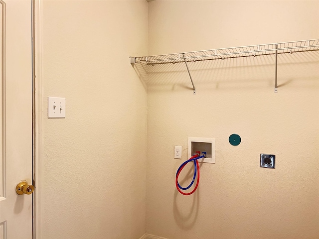 clothes washing area with hookup for an electric dryer and hookup for a washing machine