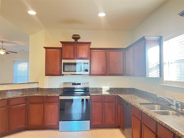 kitchen featuring ceiling fan, a healthy amount of sunlight, appliances with stainless steel finishes, and sink