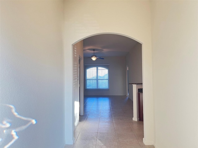 hall featuring light tile patterned floors