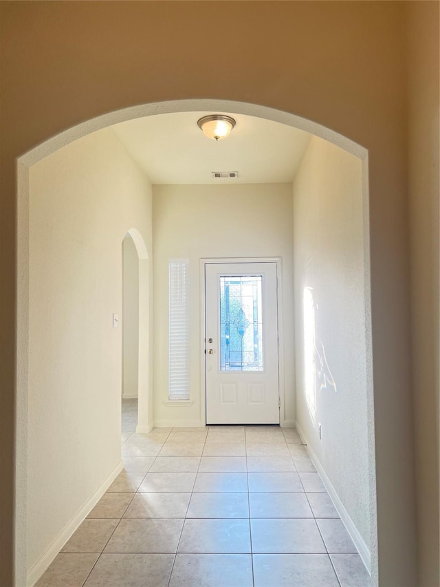 entryway featuring light tile patterned floors