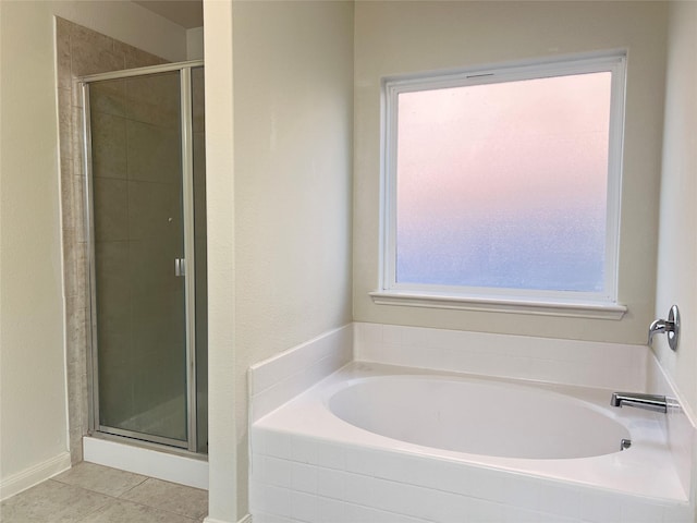 bathroom featuring independent shower and bath and tile patterned flooring