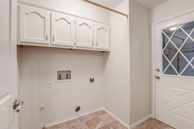 clothes washing area with cabinets, gas dryer hookup, hookup for an electric dryer, and washer hookup